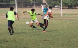 Three footballers during training